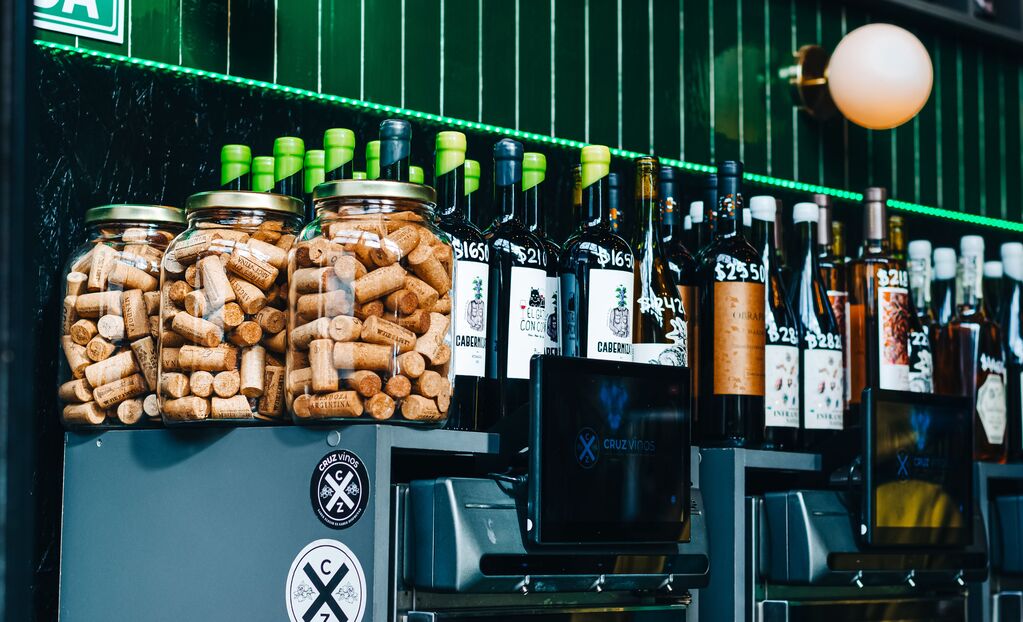Wine bottles and jars filled with natural corks on display